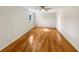 Bedroom with hardwood floors, ceiling fan, and a large window with natural light at 156 Page Pl, Canton, GA 30114