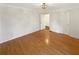 A clean, open bedroom showcasing hardwood floors, and neutral colors at 156 Page Pl, Canton, GA 30114