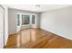 Bright bedroom features hardwood floors and a bay window offering scenic outdoor views at 156 Page Pl, Canton, GA 30114