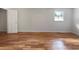 Clean bedroom features hardwood floors and a large window providing natural light at 156 Page Pl, Canton, GA 30114