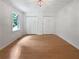 Spacious bedroom features wood floors, a window view, and ample storage with double closets at 156 Page Pl, Canton, GA 30114