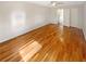 Bedroom featuring hardwood floors, ceiling fan, and access to other parts of the home at 156 Page Pl, Canton, GA 30114