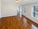 Bright dining room with gleaming hardwood floors and natural light from large windows at 156 Page Pl, Canton, GA 30114