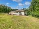 Back exterior view of a charming single-Gathering home, with a manicured lawn and secure fence at 156 Page Pl, Canton, GA 30114