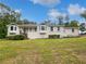 Charming brick home featuring a well-manicured front yard, complemented by bay windows and a welcoming entrance at 156 Page Pl, Canton, GA 30114