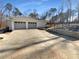 Two-car garage with automatic doors and a paved driveway at 156 Page Pl, Canton, GA 30114