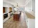 Bright kitchen with an island and tile flooring, and stainless steel appliances at 156 Page Pl, Canton, GA 30114