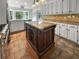 Well-lit kitchen featuring ample cabinets, a center island, and stainless steel appliances, perfect for cooking and entertaining at 156 Page Pl, Canton, GA 30114