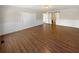 Open living room featuring hardwood floors and wainscoting, providing a cozy atmosphere at 156 Page Pl, Canton, GA 30114