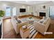 Bright living room features hardwood floors, a fireplace, and built-in shelving with neutral decor at 156 Page Pl, Canton, GA 30114