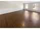 Large living room with hardwood floors, wainscoting, and natural light from large windows at 156 Page Pl, Canton, GA 30114