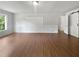 Bright living room with recessed lights featuring wood floors, fresh paint and a sliding barn door at 156 Page Pl, Canton, GA 30114