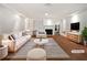 Bright living room features a fireplace, hardwood floors, and built-in bookshelves for a cozy, organized space at 156 Page Pl, Canton, GA 30114