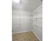 Walk-in pantry featuring wire shelving and tiled floors, providing ample storage for an organized kitchen at 156 Page Pl, Canton, GA 30114