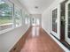 Bright sunroom featuring tile floors, windows, and access to the backyard at 156 Page Pl, Canton, GA 30114