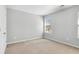Empty bedroom with neutral walls and carpet, providing a blank canvas for personalization at 2297 Elmbridge Rd, Buford, GA 30519