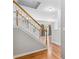 Staircase view of a hallway with hardwood floors and natural light, showcasing the home's design at 2297 Elmbridge Rd, Buford, GA 30519