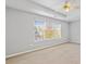 Main bedroom with a large window with a view of the neighborhood at 2297 Elmbridge Rd, Buford, GA 30519