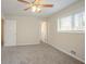 This carpeted bedroom has neutral walls, two windows, and open doorways at 4063 Elmscourt Dr, Stone Mountain, GA 30083