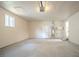 Bright garage with concrete floors, overhead lighting, and a side door at 4063 Elmscourt Dr, Stone Mountain, GA 30083