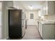 Kitchen featuring granite counters, stainless appliances, and white cabinets at 4063 Elmscourt Dr, Stone Mountain, GA 30083