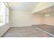 A living area featuring hardwood-style floors with a step up to the dining room at 4063 Elmscourt Dr, Stone Mountain, GA 30083