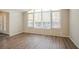 A sunny living room with hardwood-style floors and a picture window at 4063 Elmscourt Dr, Stone Mountain, GA 30083