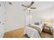 Bright bedroom features a ceiling fan, neutral decor, and carpeted floors at 1307 Madison Se Ln, Smyrna, GA 30080