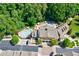 Aerial view of community pools and common areas surrounded by trees at 200 River Vista Dr # 502, Atlanta, GA 30339
