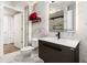 Modern bathroom with marble tile, sleek vanity, and red accent towels at 200 River Vista Dr # 502, Atlanta, GA 30339