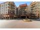 Beautiful condo building with lush landscaping and brick walkways at 200 River Vista Dr # 502, Atlanta, GA 30339