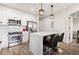 Open Kitchen with stainless appliances, white cabinetry, and island with seating at 200 River Vista Dr # 502, Atlanta, GA 30339