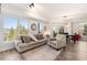 Spacious living room with large windows providing natural light and wooded views at 200 River Vista Dr # 502, Atlanta, GA 30339