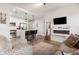 Open concept living room and kitchen area, showcasing modern decor and abundant natural light at 200 River Vista Dr # 502, Atlanta, GA 30339