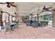 Outdoor patio with ceiling fans, wrought iron railing, and brick flooring at 200 River Vista Dr # 502, Atlanta, GA 30339