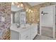Dual sinks and tub/shower combination can be found in this bath at 223 Ivy Creek Dr, Loganville, GA 30052