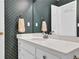 Bathroom featuring a vanity with drawers and cabinets and a mirror at 223 Ivy Creek Dr, Loganville, GA 30052