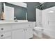Bathroom featuring a vanity with drawers and cabinets, a toilet, and a shower-tub combo at 223 Ivy Creek Dr, Loganville, GA 30052