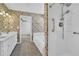Bathroom with dual vanities, garden tub, and separate shower at 223 Ivy Creek Dr, Loganville, GA 30052