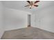 A carpeted bedroom with a ceiling fan and closet is move-in ready at 223 Ivy Creek Dr, Loganville, GA 30052