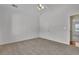 A comfortable bedroom features carpeted floors and an ensuite bath at 223 Ivy Creek Dr, Loganville, GA 30052