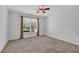 A bedroom featuring neutral colored walls and a window at 223 Ivy Creek Dr, Loganville, GA 30052