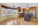Kitchen nook with hardwood floors, bay windows, and stainless steel appliances at 223 Ivy Creek Dr, Loganville, GA 30052