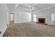 The living room features a fireplace, ceiling fan, and a door to the backyard at 223 Ivy Creek Dr, Loganville, GA 30052