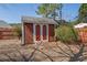 Backyard storage shed in a fenced yard with easy access for storing tools and outdoor equipment at 223 Ivy Creek Dr, Loganville, GA 30052