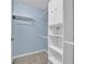 Spacious walk-in closet featuring built-in shelving and ample storage space at 223 Ivy Creek Dr, Loganville, GA 30052