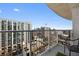 Balcony view overlooking the city skyline with modern railings and outdoor seating at 250 Pharr Ne Rd # 1702, Atlanta, GA 30305