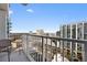 Balcony view of city skyline, modern railings, and outdoor chair at 250 Pharr Ne Rd # 1702, Atlanta, GA 30305