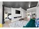 Open concept bedroom featuring television, view to the kitchen, and natural light at 250 Pharr Ne Rd # 1702, Atlanta, GA 30305