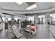 Well-equipped gym with various exercise machines, weights, and large windows for natural light at 250 Pharr Ne Rd # 1702, Atlanta, GA 30305